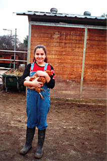 girl holding chicken